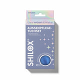 SHILOX Külső Ápoló Kendőcsomag mikroszálas és üvegtisztító kendővel, eredeti csomagolásban, fehér háttéren.